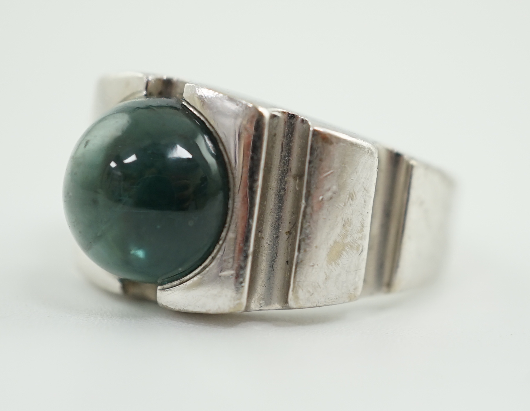 An 18ct white gold and single stone blue green cabochon tourmaline set ring